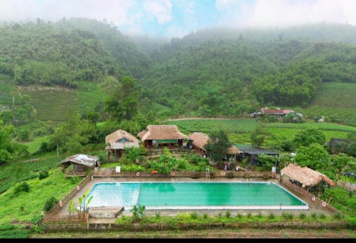 an aerial view of a resort with a swimming pool at La Bằng Homestay in Lá Cam