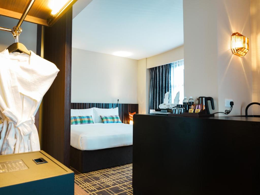 Postel nebo postele na pokoji v ubytování Starus Hotel Bukit Bintang