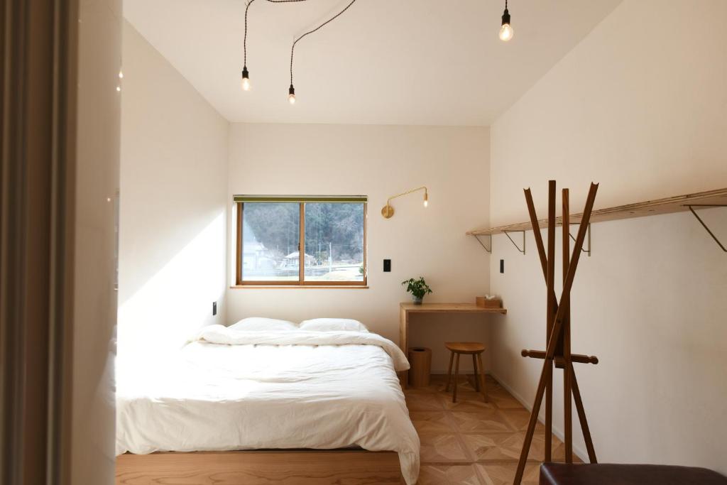 Кровать или кровати в номере 田万里家 FARM STAY / Tamari Ya FARM STAY