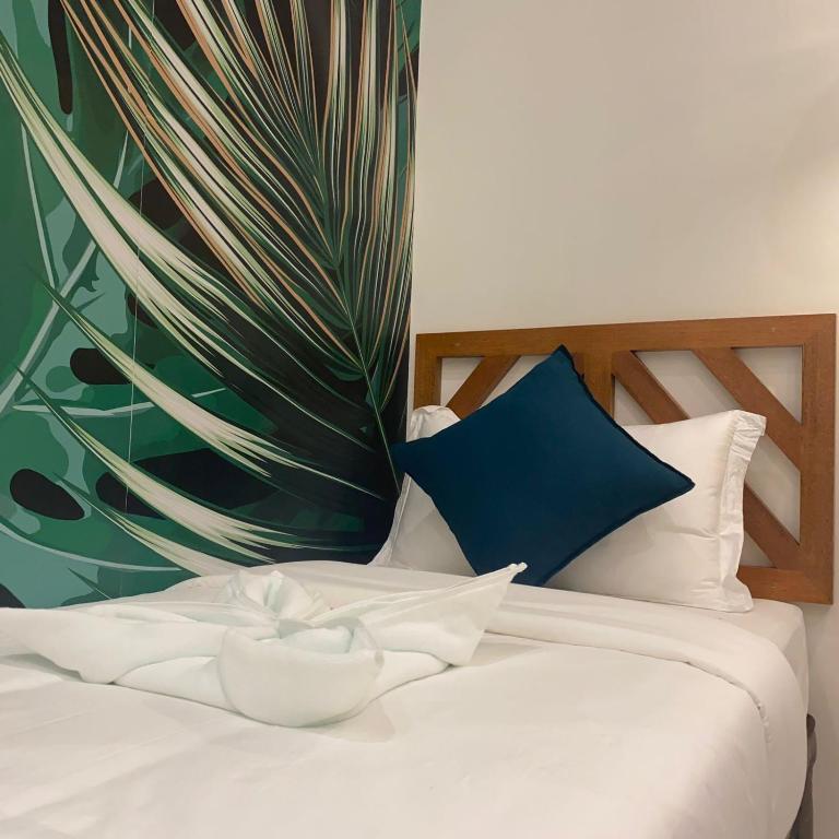 Postel nebo postele na pokoji v ubytování Bahandi Hotel