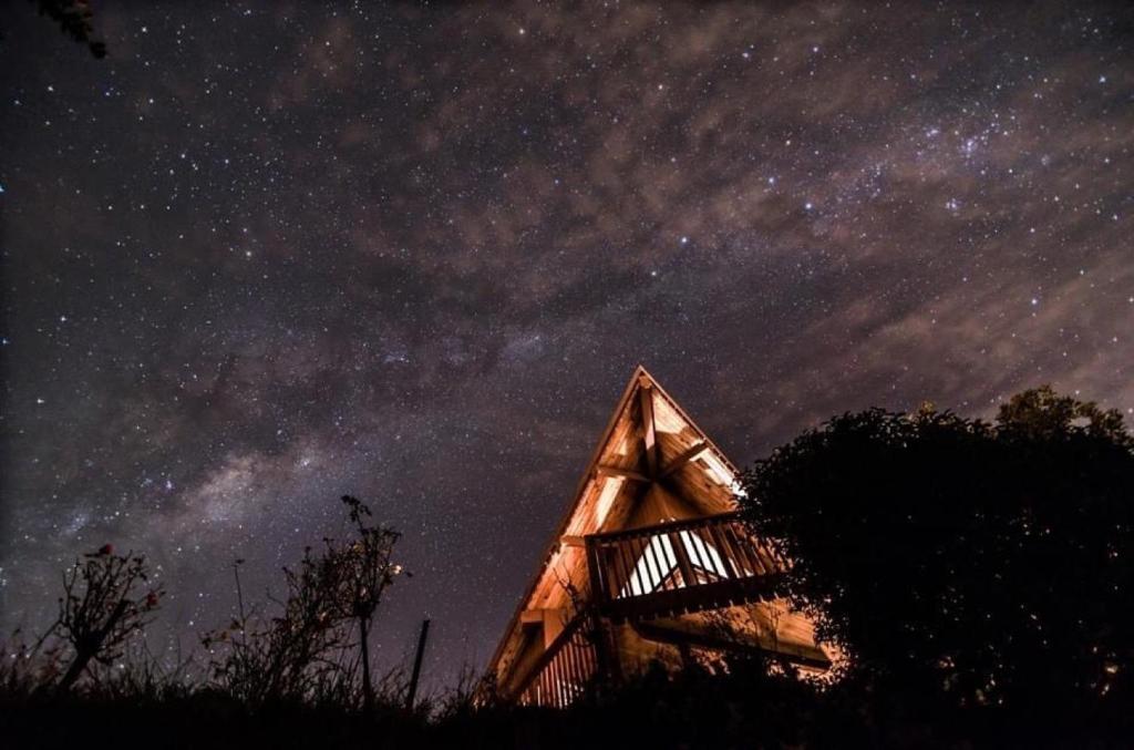 a cabin under a night sky with the milky way at Eclectic Luxurious 70s Mansion in Wellington