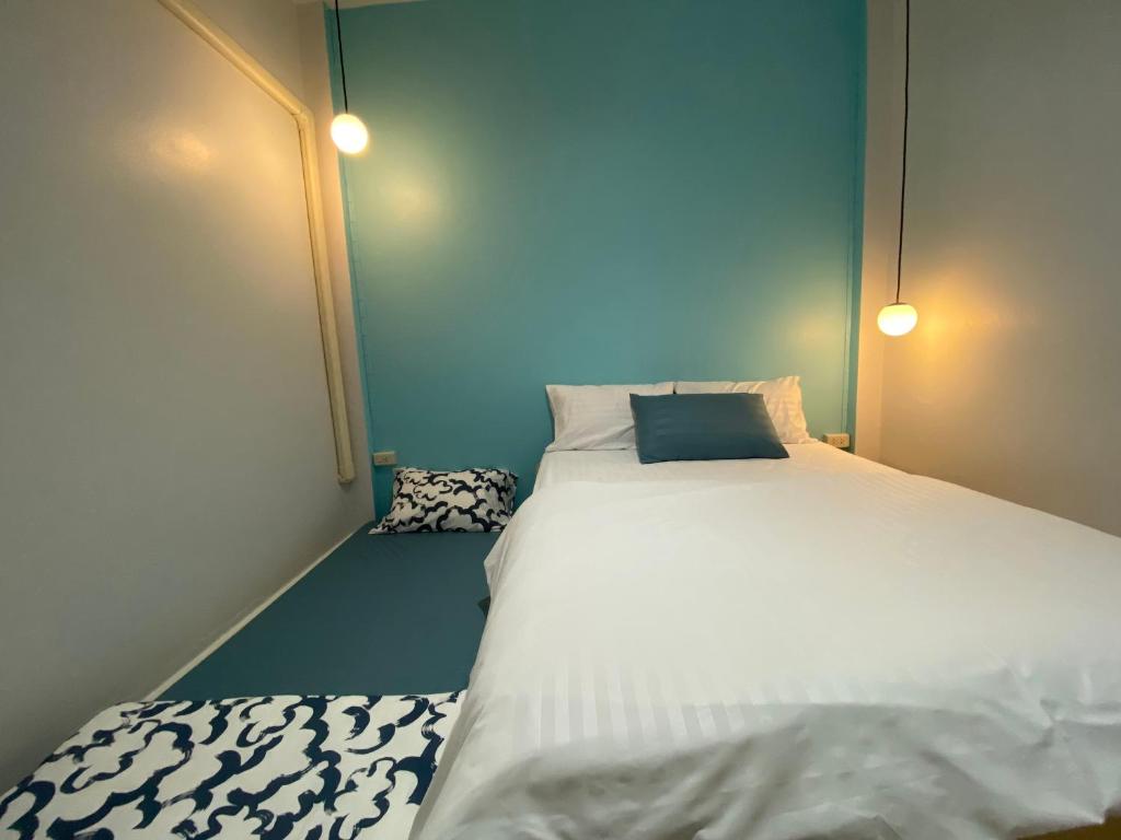 Postel nebo postele na pokoji v ubytování FEEL LIKE HOME BETONG ฟีลไลค์โฮม เบตง