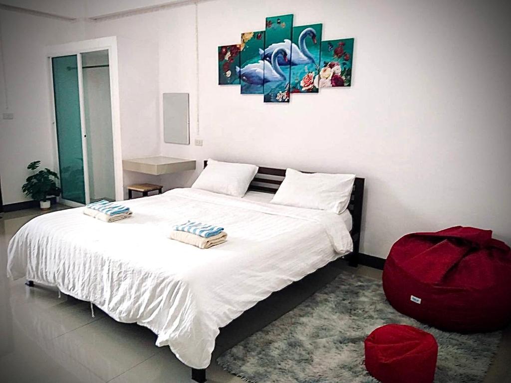 Postel nebo postele na pokoji v ubytování MY HOME Hotel - Phutthamonthon 4 Road, near Mahidol University Salaya