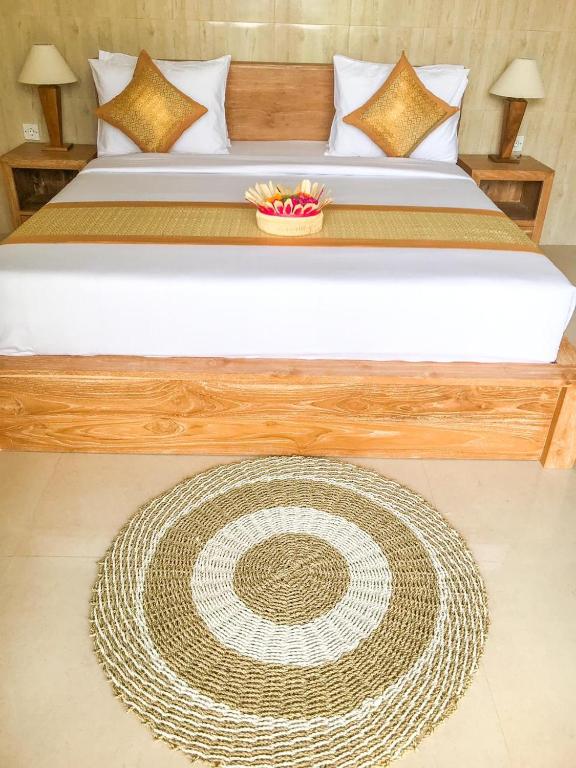 Postel nebo postele na pokoji v ubytování Heri house ubud