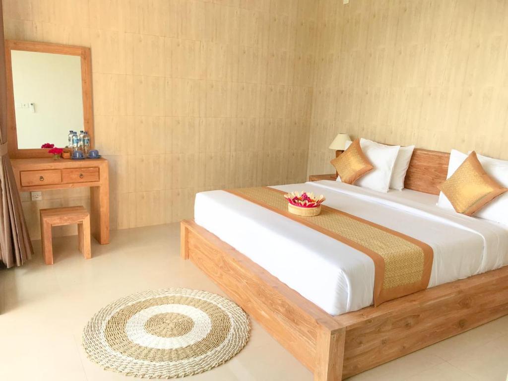 Postel nebo postele na pokoji v ubytování Heri house ubud