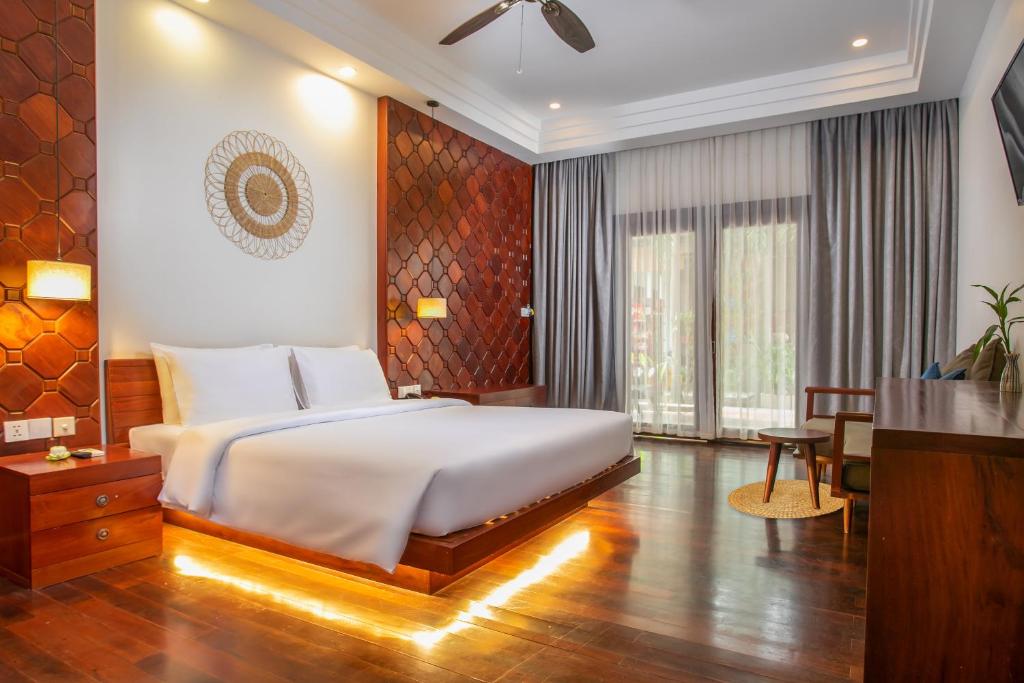 Postel nebo postele na pokoji v ubytování Mera Residence