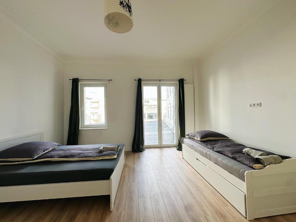 Cama o camas de una habitación en Zentralmoers 140m2 Hbf Nah