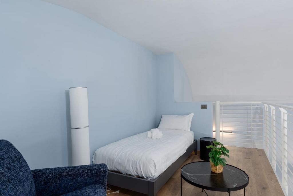 Ένα ή περισσότερα κρεβάτια σε δωμάτιο στο Q71 TIMELESS SUITES