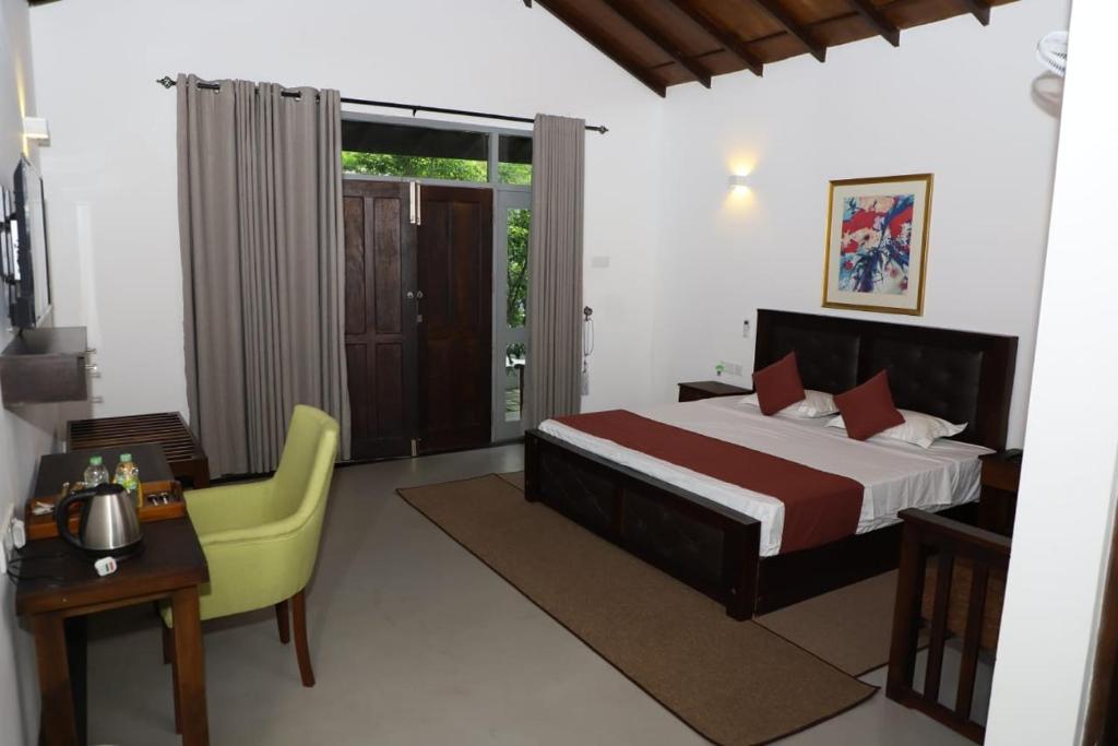 Postel nebo postele na pokoji v ubytování Hotel Ro Kalawewa