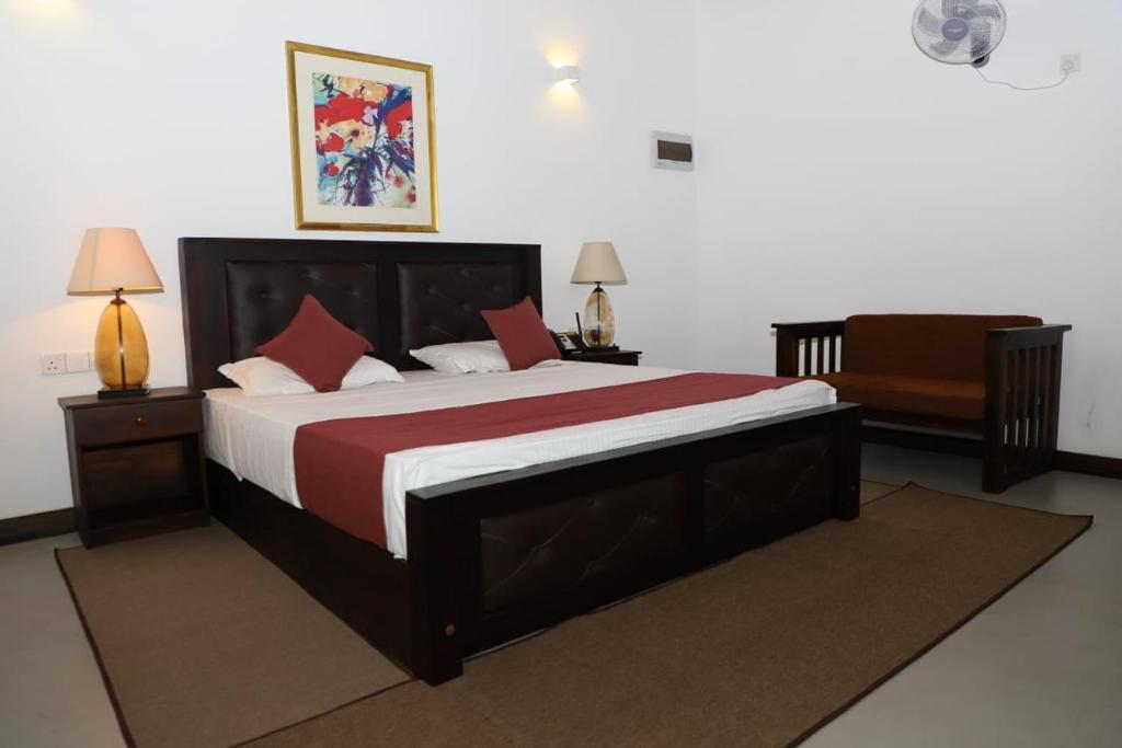 Postel nebo postele na pokoji v ubytování Hotel Ro Kalawewa
