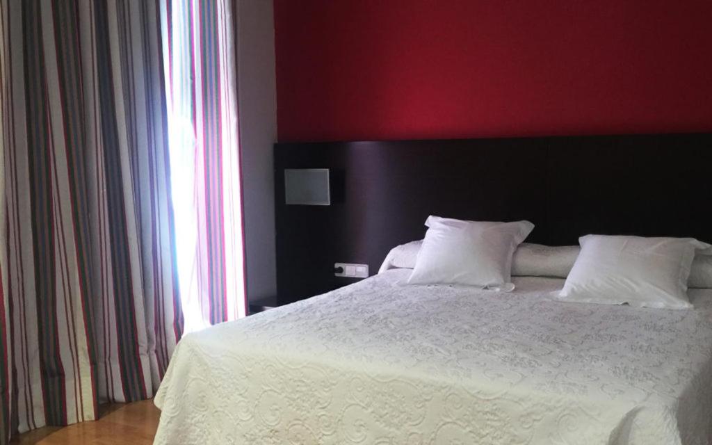 Postel nebo postele na pokoji v ubytování Hotel Bruc
