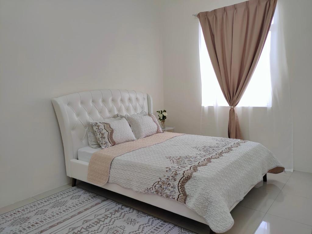Postel nebo postele na pokoji v ubytování Rana Homestay Ipoh Perak