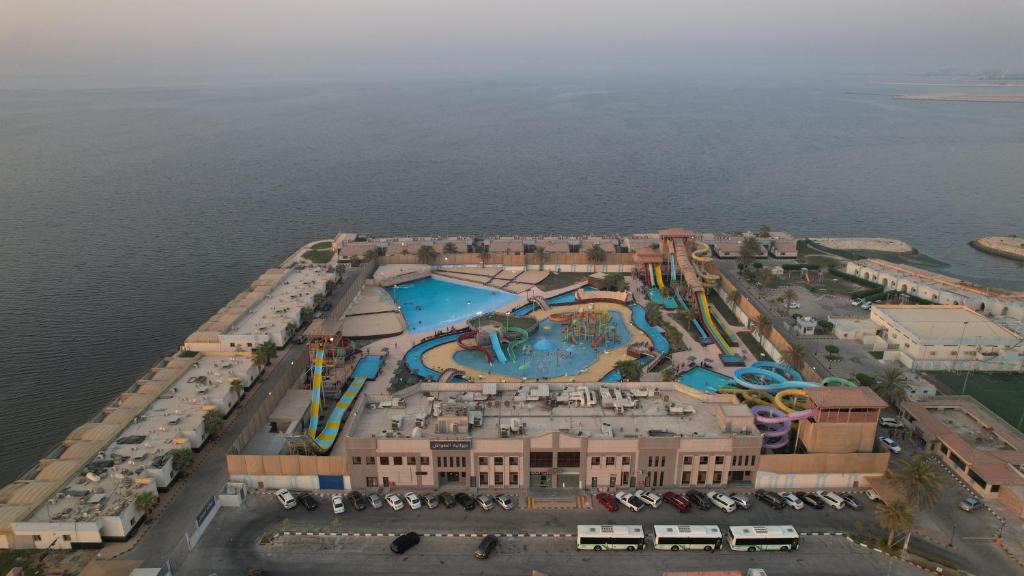 an aerial view of a resort with a swimming pool at Sea Club Resort in Dammam