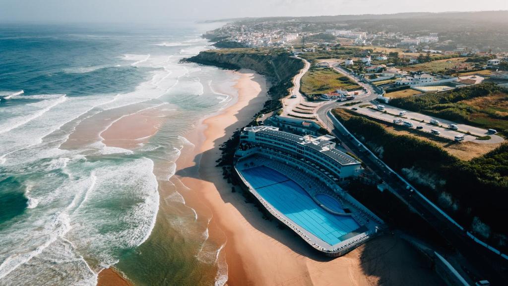 an aerial view of a beach with a swimming pool at Arribas Sintra Hotel in Sintra
