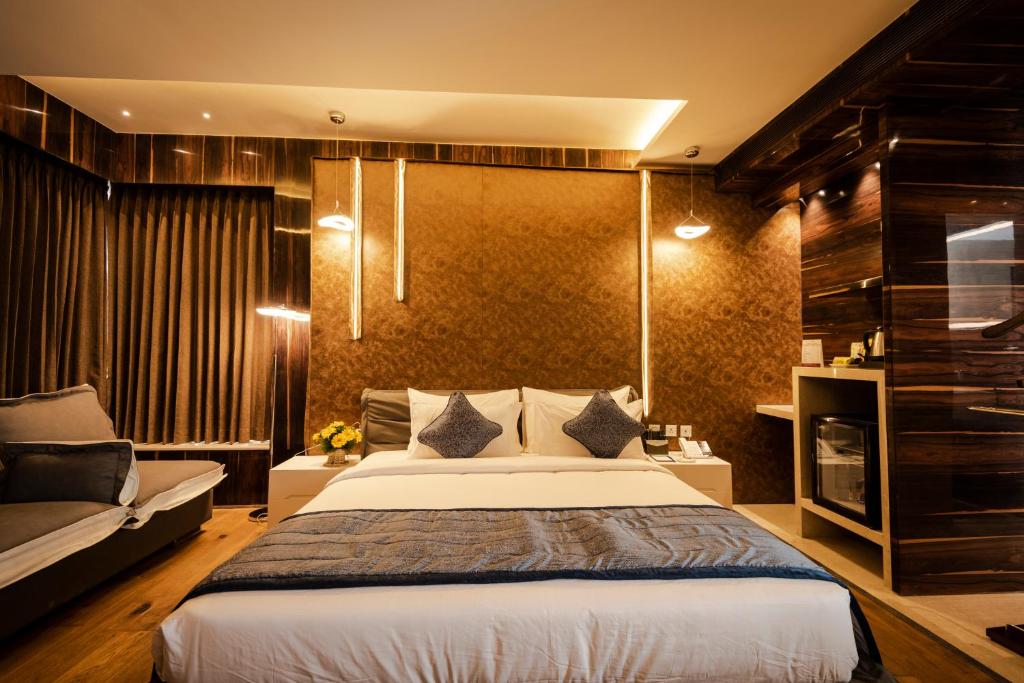 Postel nebo postele na pokoji v ubytování Hotel Park Elanza Coimbatore