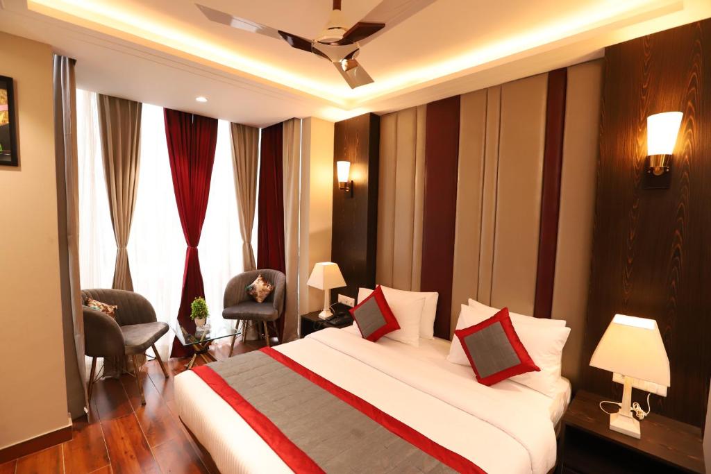 Postel nebo postele na pokoji v ubytování Hotel The Magic Tree - Paharganj New Delhi