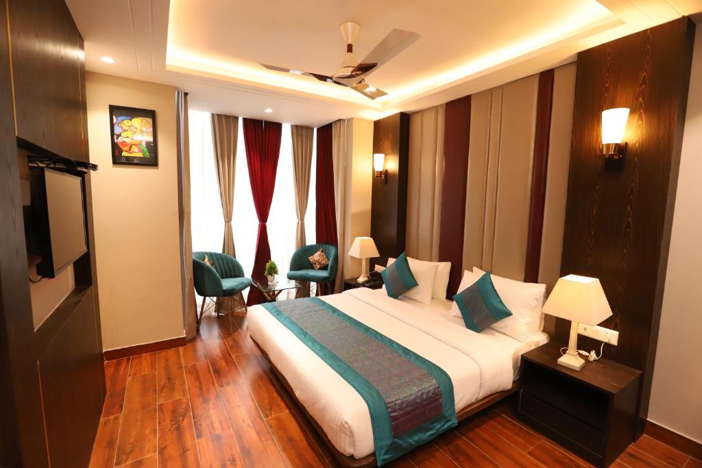 Postel nebo postele na pokoji v ubytování Hotel The Magic Tree - Paharganj New Delhi