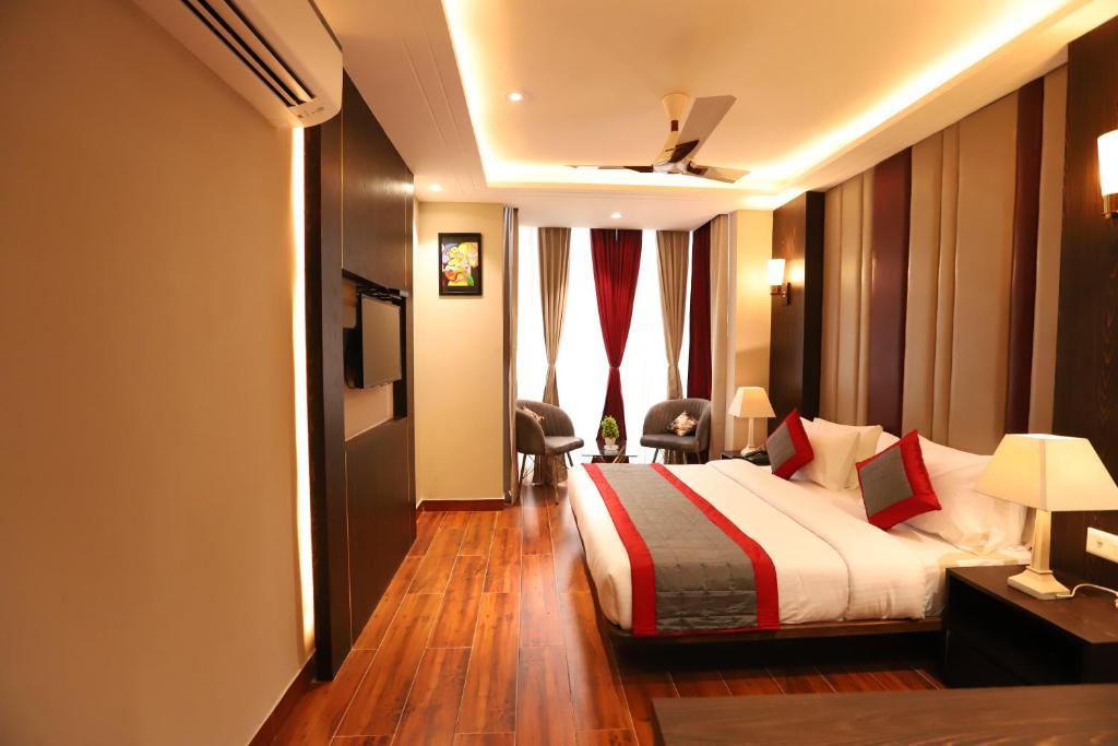 Postel nebo postele na pokoji v ubytování Hotel The Magic Tree - Paharganj New Delhi