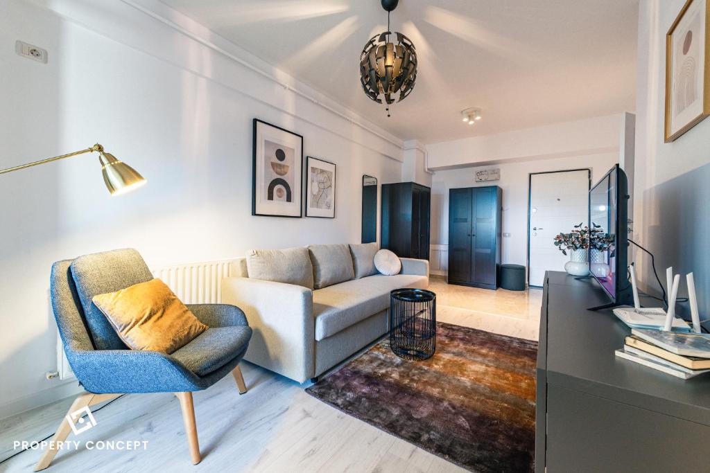 a living room with a couch and a tv at Central Residence Apartment 505 in Bucharest
