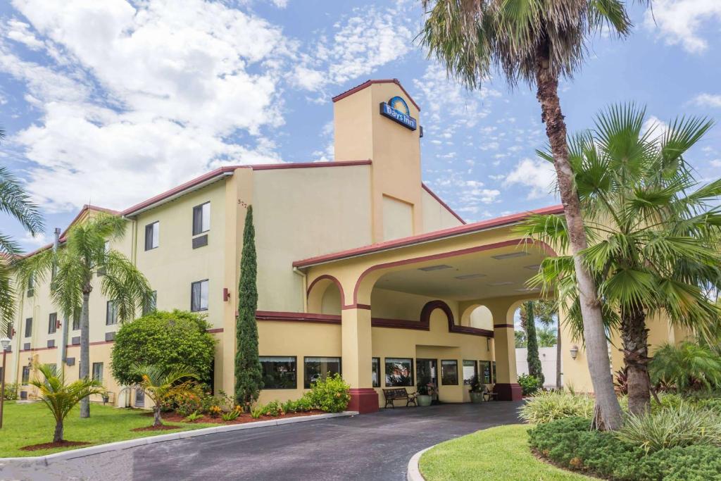 a building with a clock on the top of it at Days Inn by Wyndham Sarasota I-75 in Sarasota