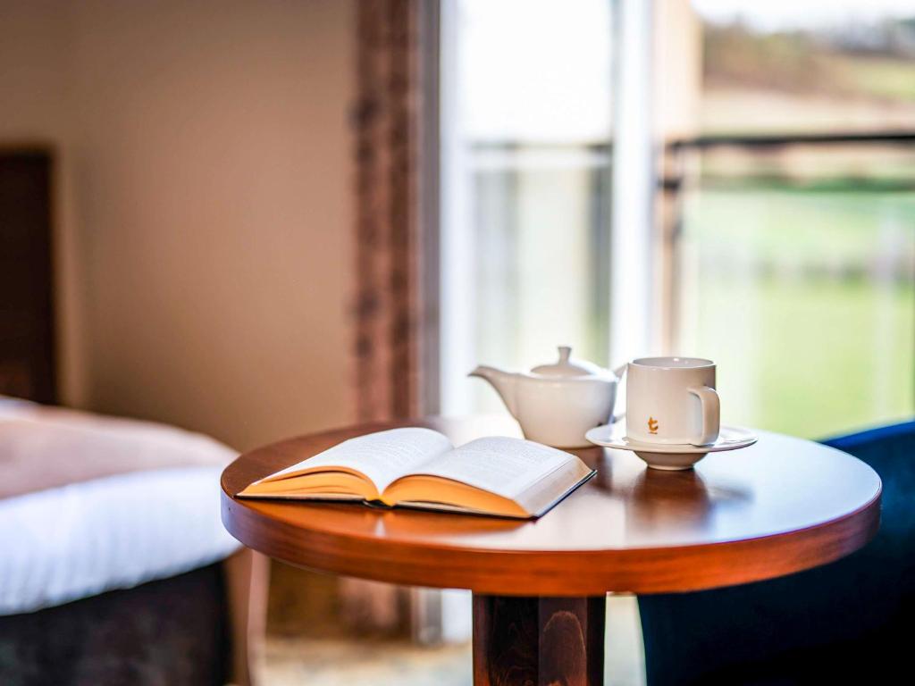 Postel nebo postele na pokoji v ubytování Dosłońce Resort Wellness & Farm