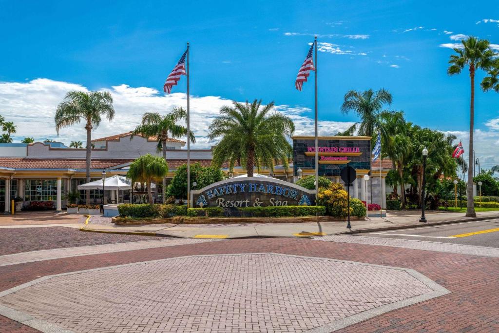 a town square with american flags in front of a shopping center at Safety Harbor Resort & Spa Trademark Collection by Wyndham in Safety Harbor
