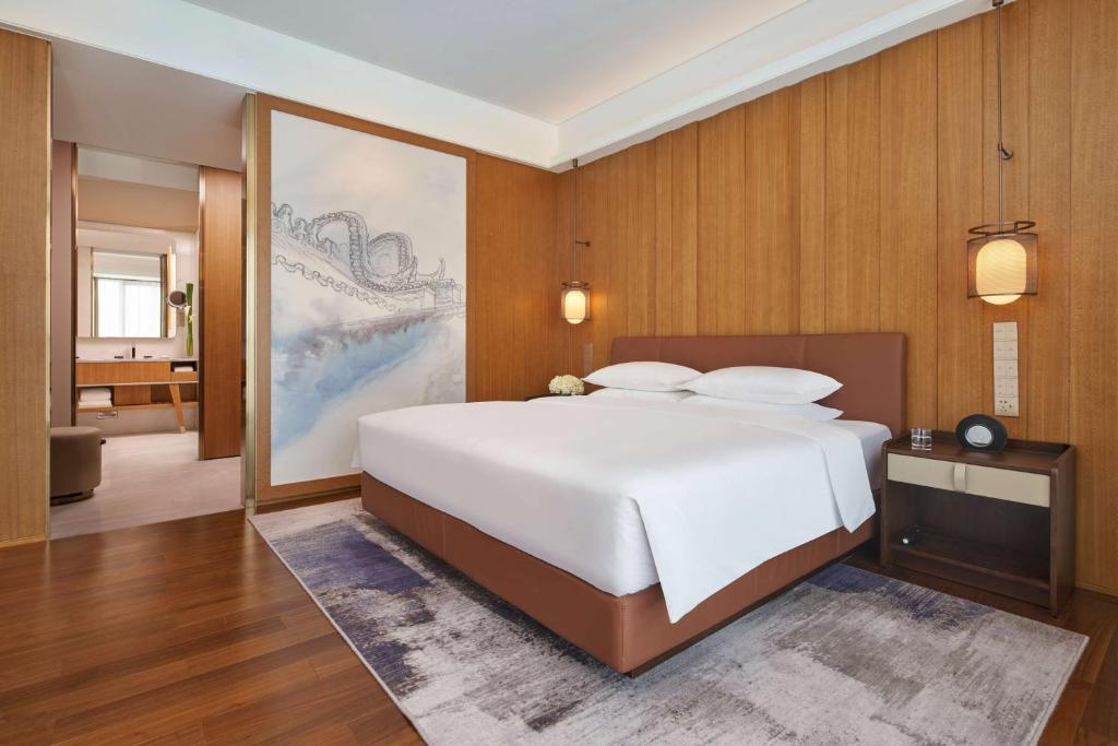 Postel nebo postele na pokoji v ubytování Hyatt Regency Guangzhou Zengcheng