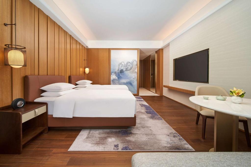 Postel nebo postele na pokoji v ubytování Hyatt Regency Guangzhou Zengcheng