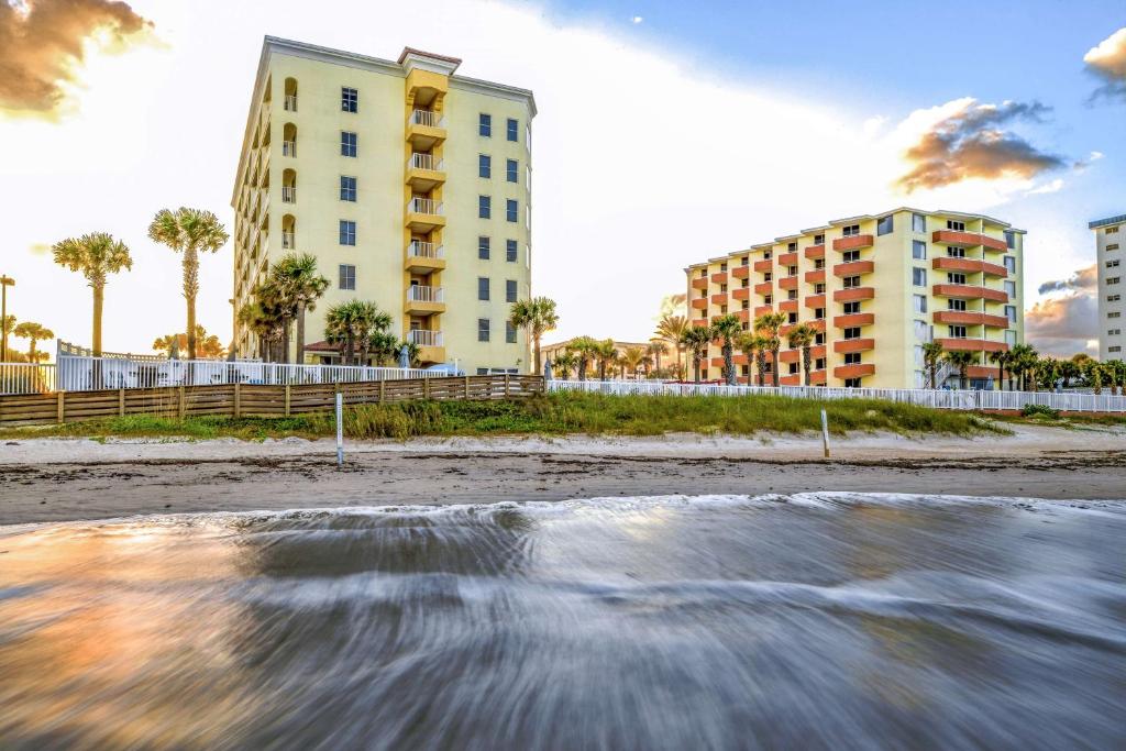 a view of the beach with buildings and condos at Hilton Vacation Club The Cove on Ormond Beach in Ormond Beach