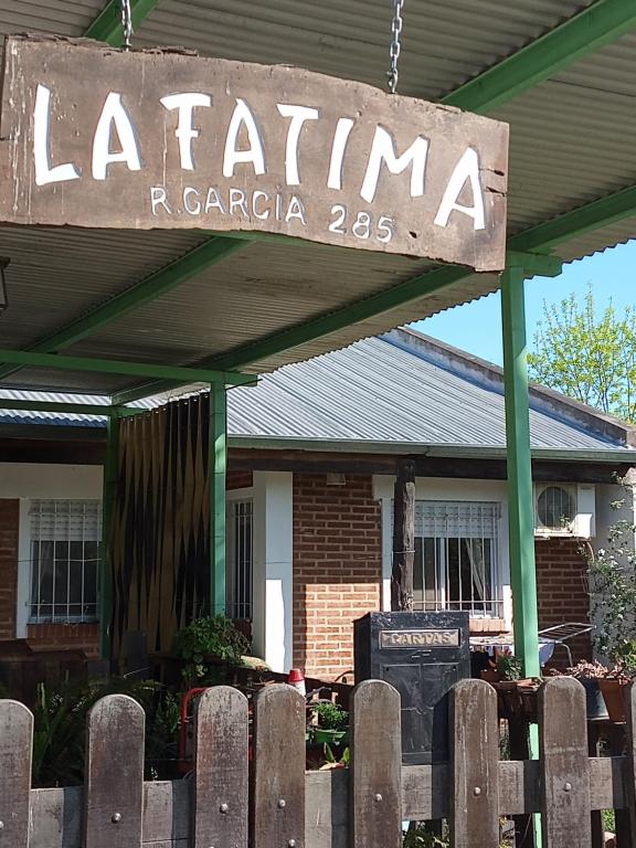 a sign for a la fernanda restaurant in front of a building at LA FATIMA in Gualeguaychú