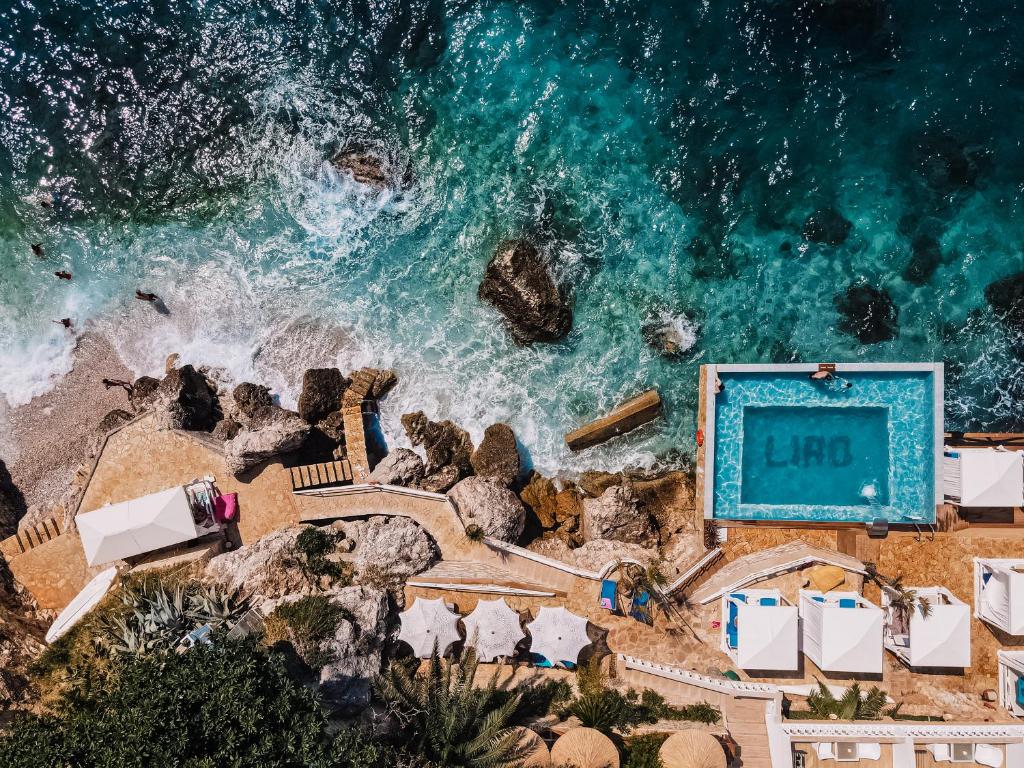 an overhead view of a pool and the ocean at Hotel Liro - Adults Only in Vlorë