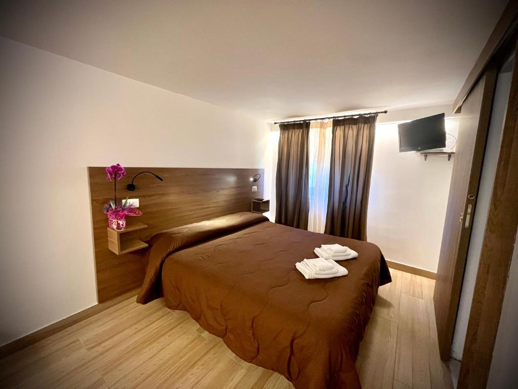 Postel nebo postele na pokoji v ubytování Hotel Pinguino