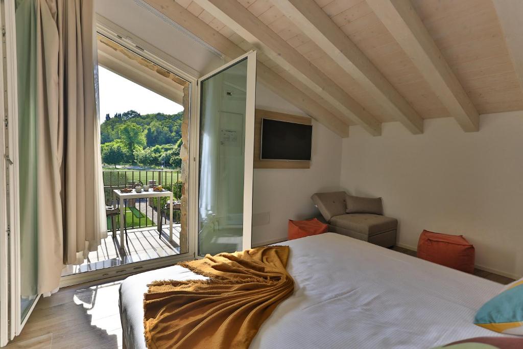 Postel nebo postele na pokoji v ubytování Casa Massaro Todeschini