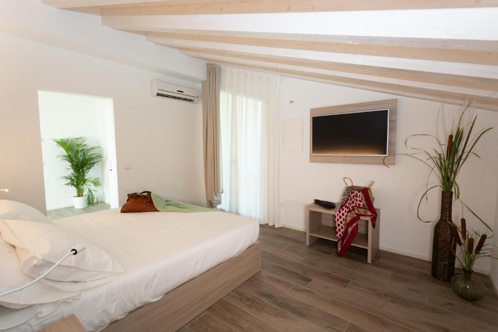 Postel nebo postele na pokoji v ubytování Casa Massaro Todeschini