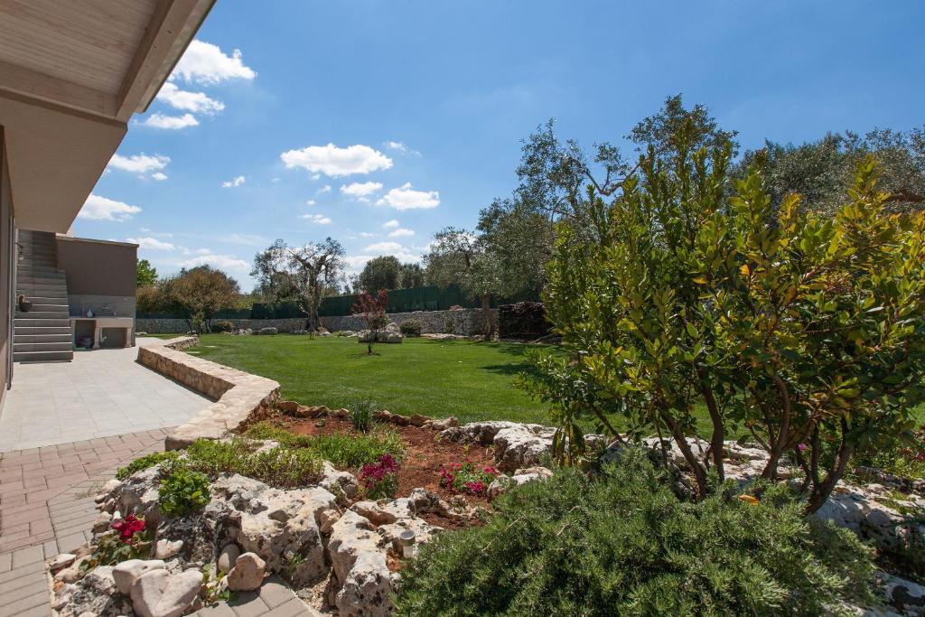A garden outside Villa Daiana by Perle di Puglia