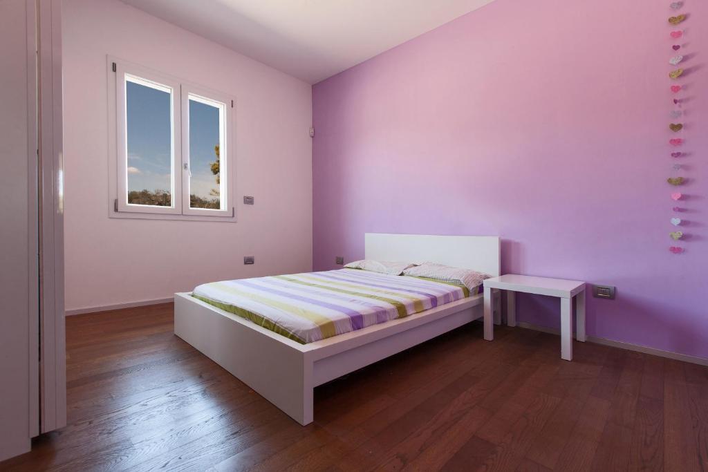 A bed or beds in a room at Villa Daiana by Perle di Puglia