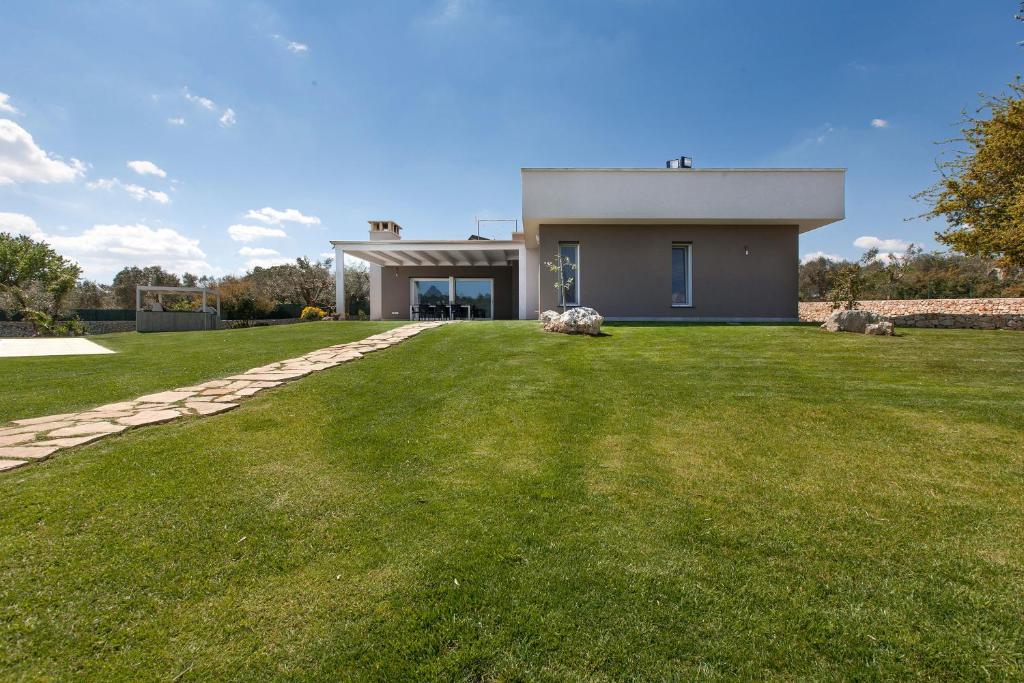 A garden outside Villa Daiana by Perle di Puglia