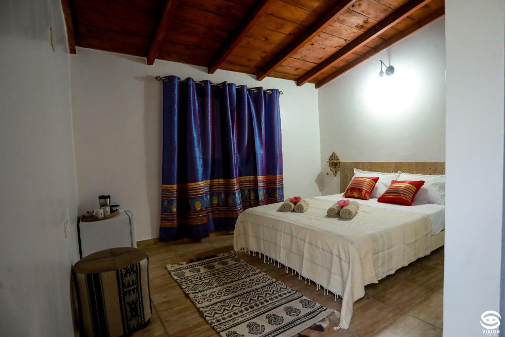 Postel nebo postele na pokoji v ubytování Dar Barka