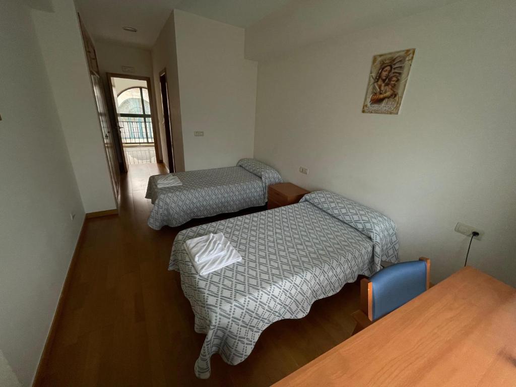 Posteľ alebo postele v izbe v ubytovaní Casa Diocesana VIA LUCIS
