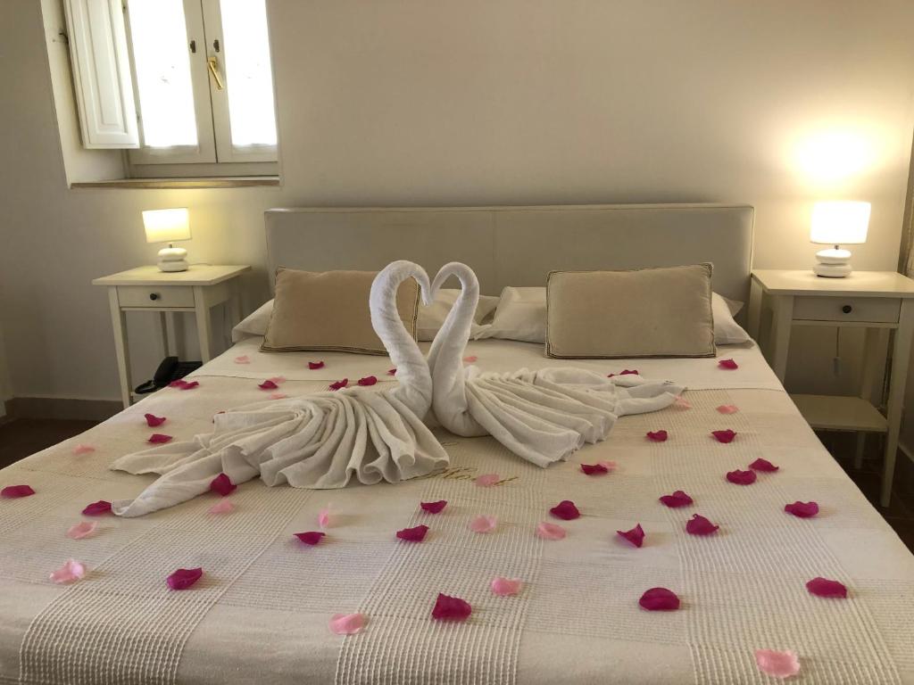 Postel nebo postele na pokoji v ubytování Caveoso Hotel