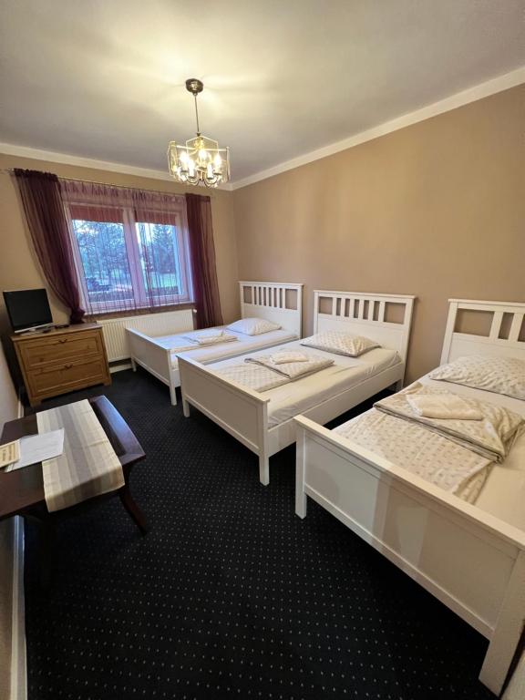 Postel nebo postele na pokoji v ubytování Noclegi AirportPark