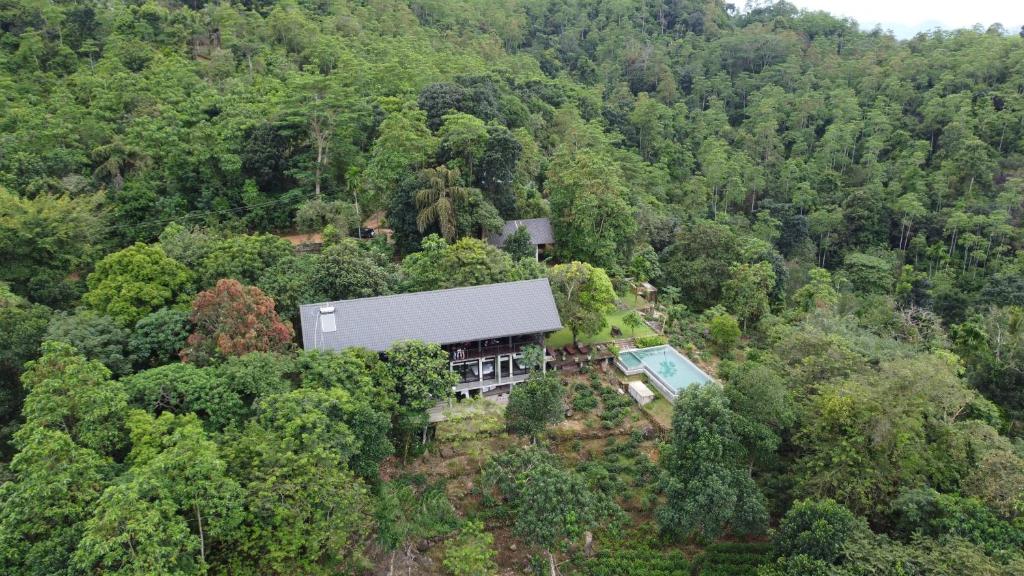 an aerial view of a house in the middle of a forest at Ahas Gawwa in Padukka