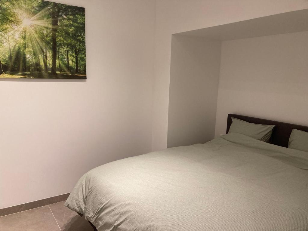 Cama ou camas em um quarto em Vakantiehuis En Passant