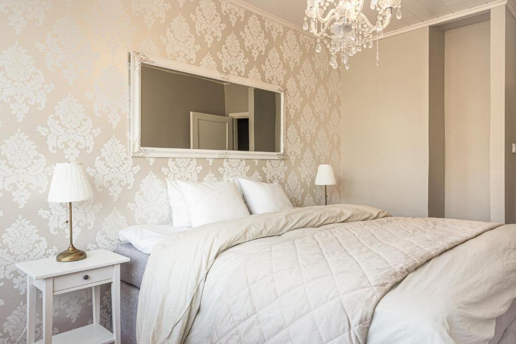 Postel nebo postele na pokoji v ubytování City Apartment Lumikko