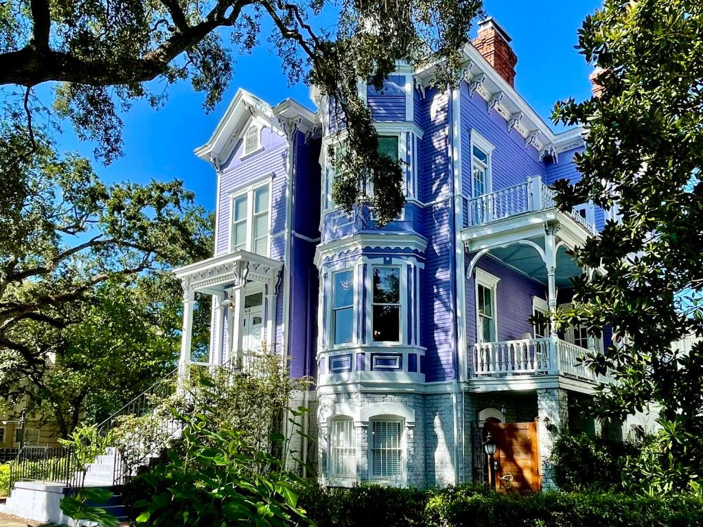 a large blue house with white trim at Amethyst Garden in Savannah