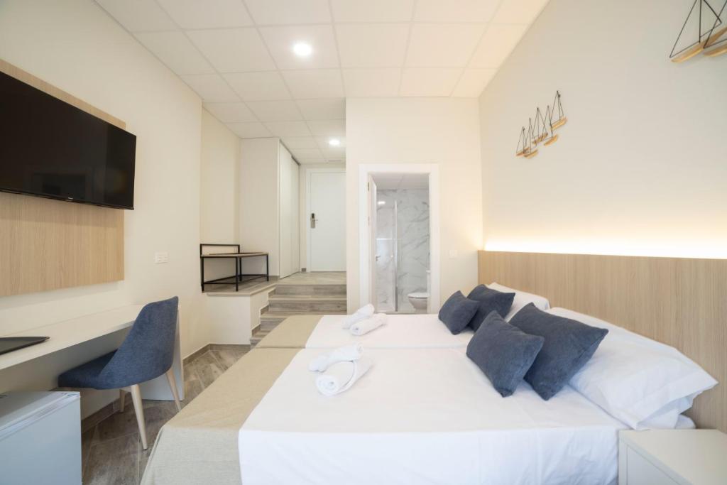 TV a/nebo společenská místnost v ubytování Hostal Altea Karma
