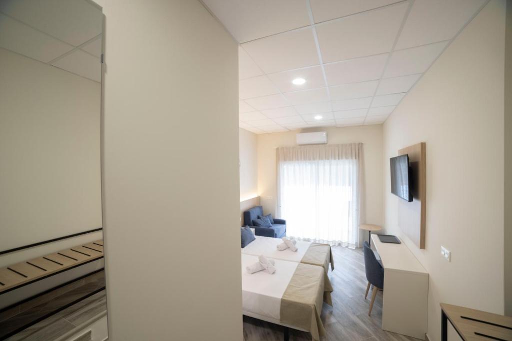 Postel nebo postele na pokoji v ubytování Hostal Altea Karma