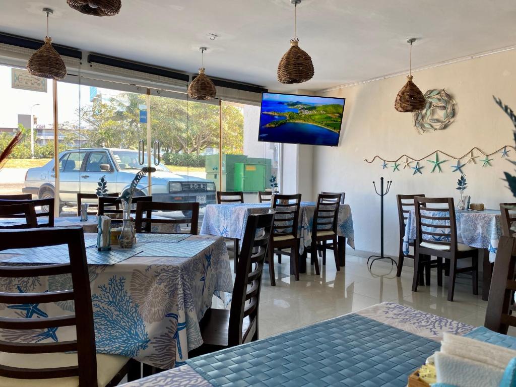 Restaurace v ubytování Hotel Playa de Oro - Enfrente de WTC y Plazas Comerciales