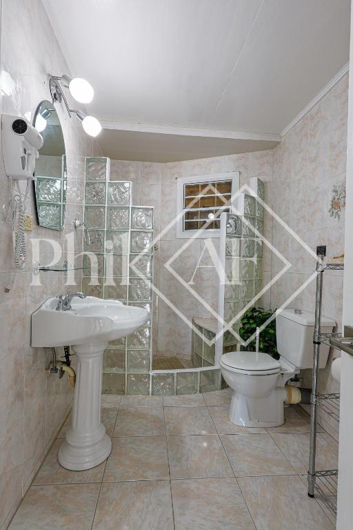 Koupelna v ubytování Spacieux Duplex de 3 chambres à Gd Case