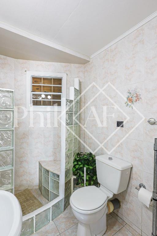 Koupelna v ubytování Spacieux Duplex de 3 chambres à Gd Case